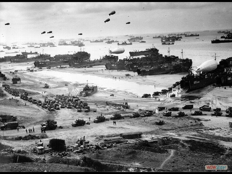 Allied troops unload equipment and supplies on Omaha Beach in Normandy, France